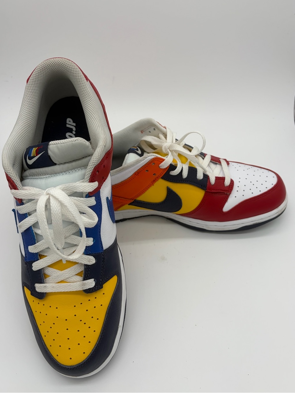Nike Dunk CO.JP Low-Top Sneakers in Red, Yellow, Blue, White